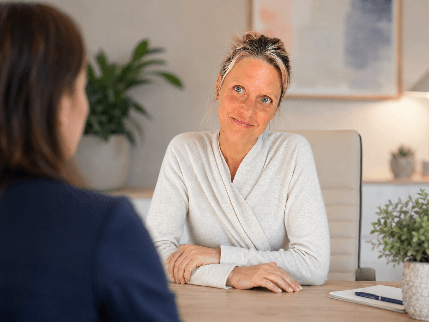 Tasha Darwent in conversation with a client